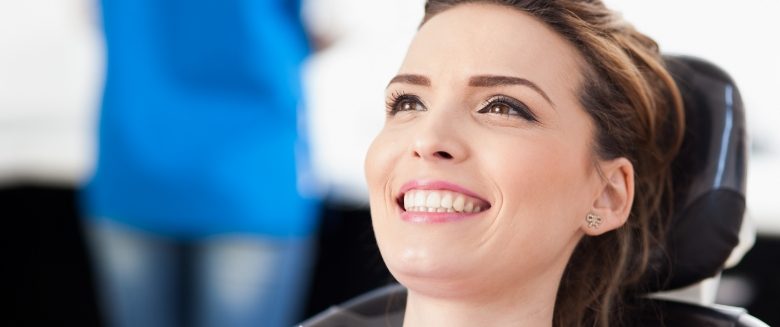 Female patient smiling in dental chair