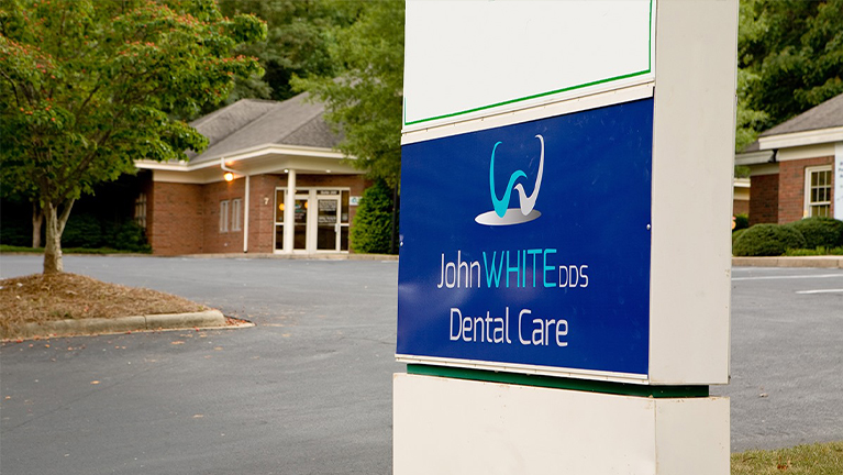 Sign for John White DDS Dental Care in Asheville