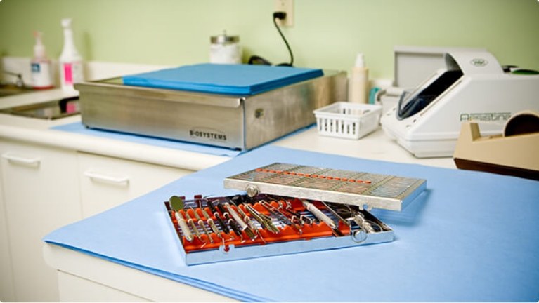 Dental instruments in box on top of table in dental office