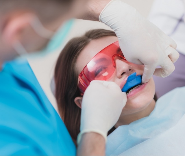 Young female patient receiving a fluoride treatment