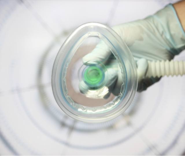 POV shot of nasal mask being placed for dental sedation in Asheville